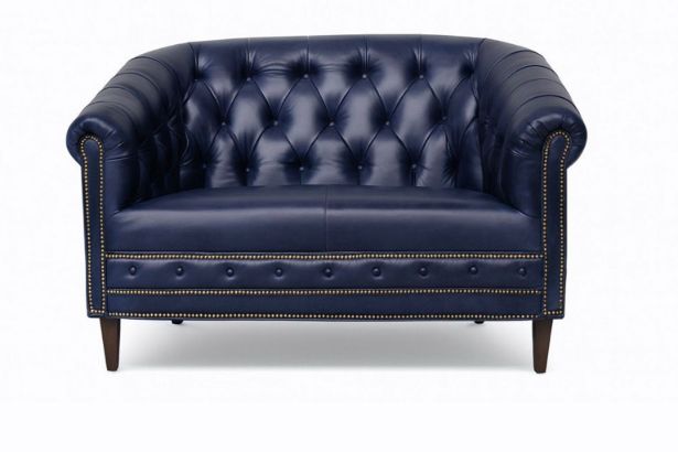 Lux and Borough Stafford style custom loveseat showcasing a grand camelback silhouette, elegantly rolled arms, tight tailoring, and a timeless full-length dressmaker skirt.